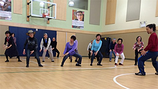Older Americans during movement exercise class at Asian Counseling and Referral Services, Seattle